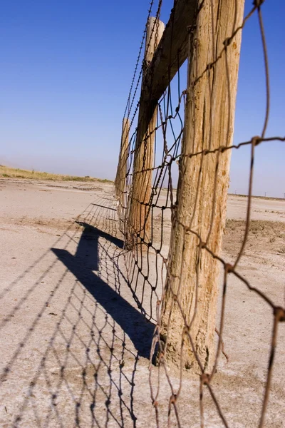 stock image Wire and Wooden Fence Under Clear Skies