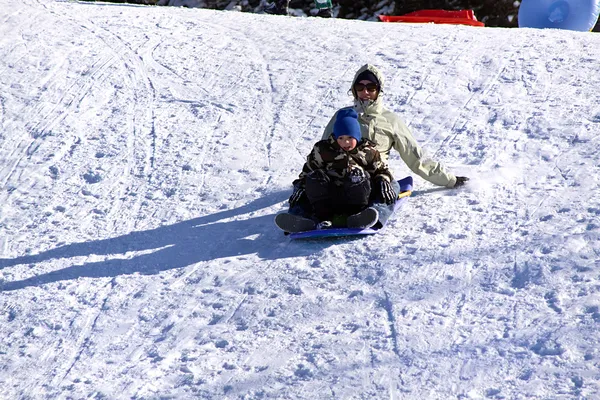 Mother and Son Sledding down the Hill — Stock Photo, Image
