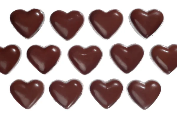 Темные шоколадные конфеты в форме сердца — стоковое фото