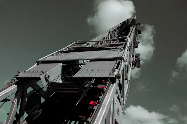 Fire Truck Ladder into Steel Gray Sky — Stock Photo, Image