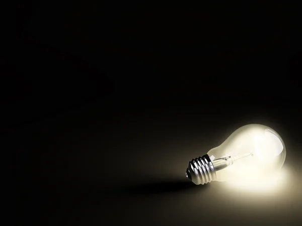 黒の上の明るい電球 ロイヤリティフリーのストック画像