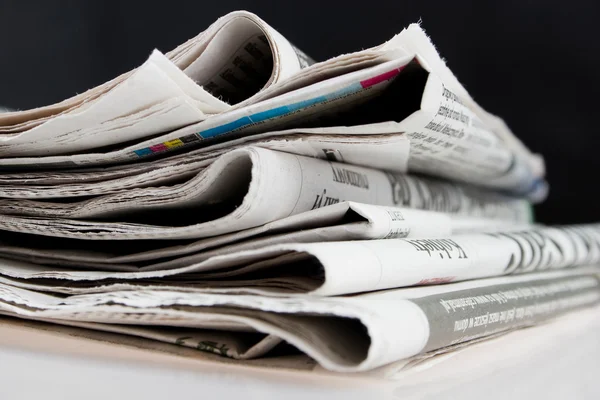 stock image Newspapers on black background