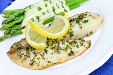 Fresh Tilapia fish dinner with asparagus clipart