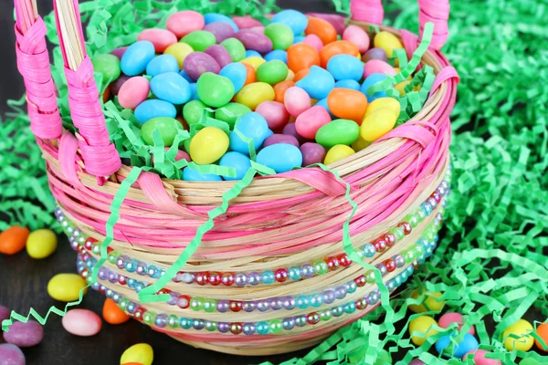 Easter candy in Easter basket — Stock Photo, Image