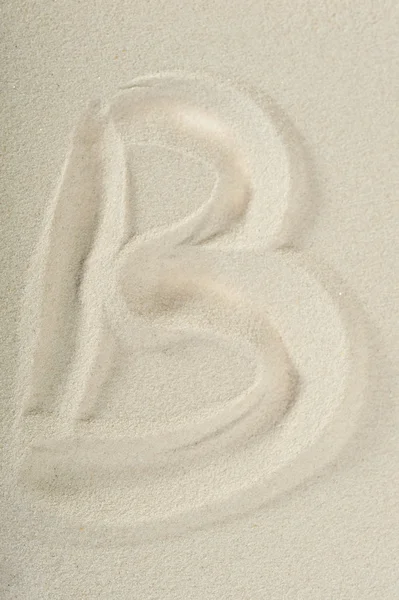 Letter written on sand — Stock Photo, Image
