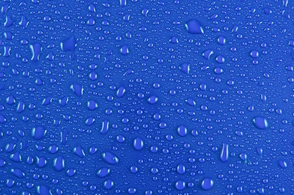 Σταγόνες νερού σε μπλε — Φωτογραφία Αρχείου