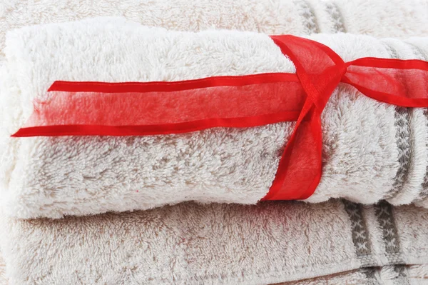 Towels and red tape — Stock Photo, Image