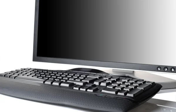 Monitor y teclado negro —  Fotos de Stock