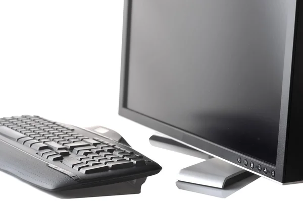 Monitor e teclado preto — Fotografia de Stock