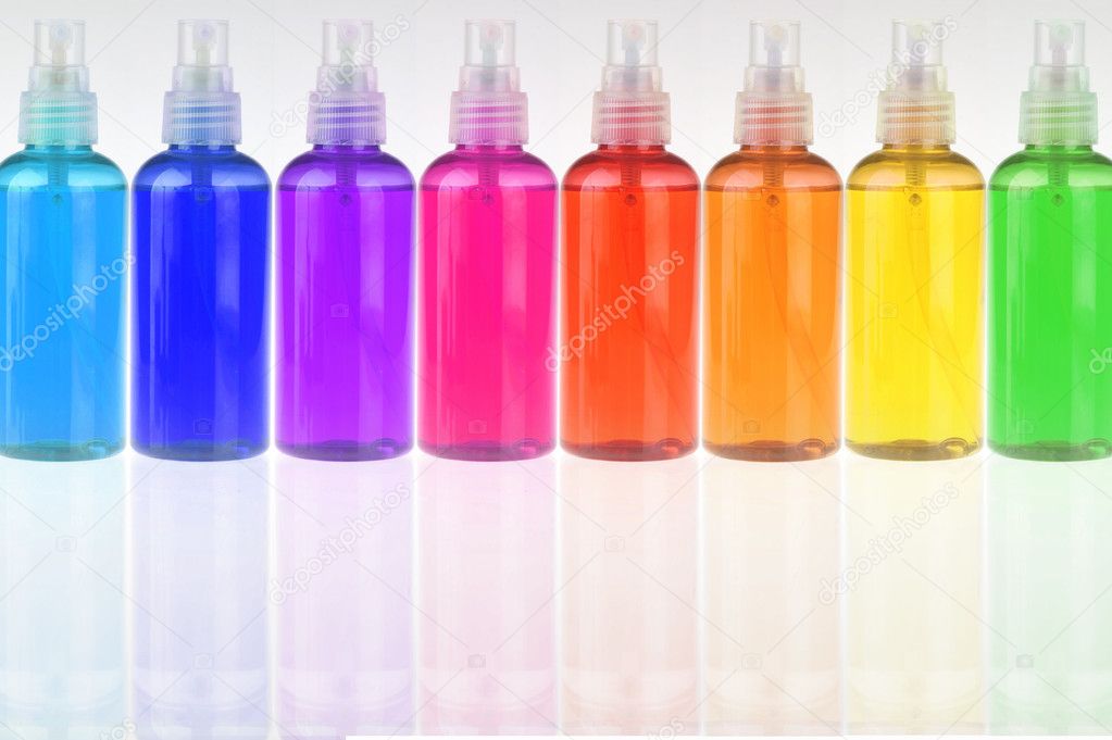 Colored bottles with cosmetics in a row