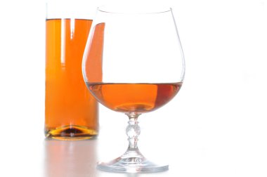 Bootle and glass of brandy clipart