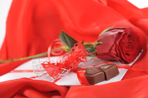 Chocolate and rose — Stock Photo, Image