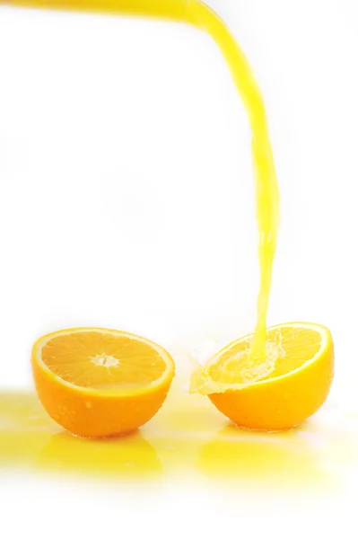 Juice stänk på orange — Stockfoto