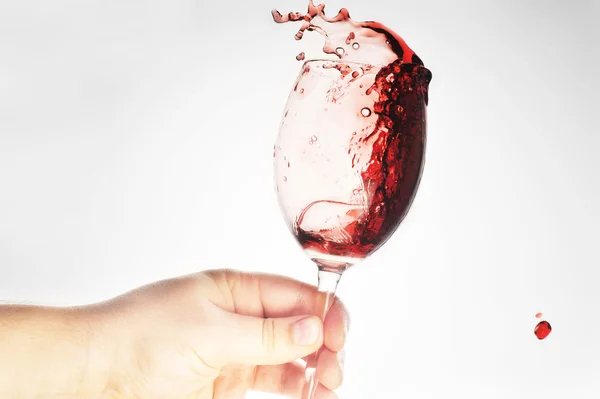 Hand holding glass with wine — Stock Photo, Image
