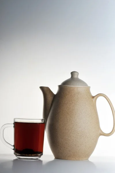 stock image Cup of tea and teapot