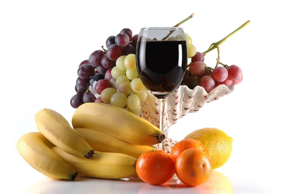 Different fruits and glass of wine — Stock Photo, Image