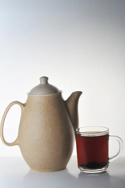 stock image Cup of tea and teapot