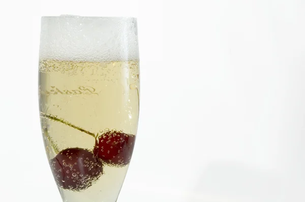 Champagne with cherry — Stock Photo, Image