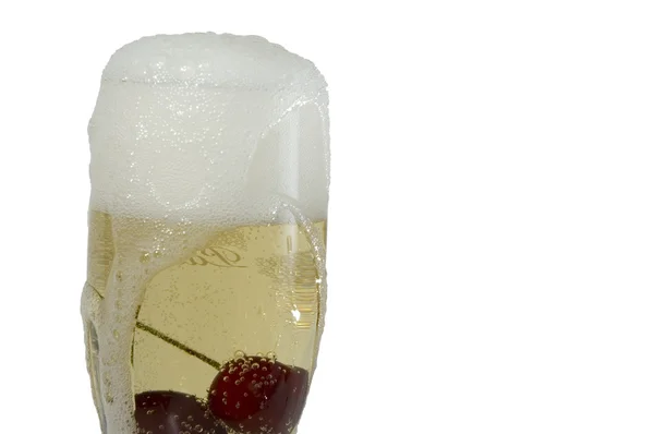 Champagne with cherry in it — Stock Photo, Image