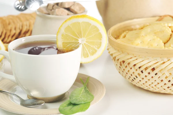 En kopp te och kakor — Stockfoto