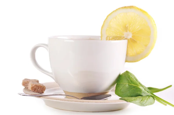 Full cup of tea with lemon — Stock Photo, Image