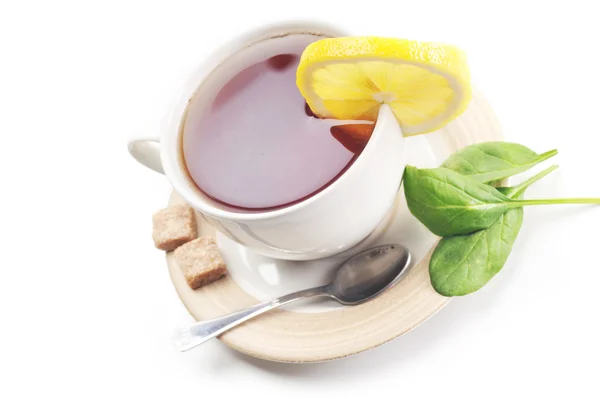 Tazza piena di tè con limone — Foto Stock