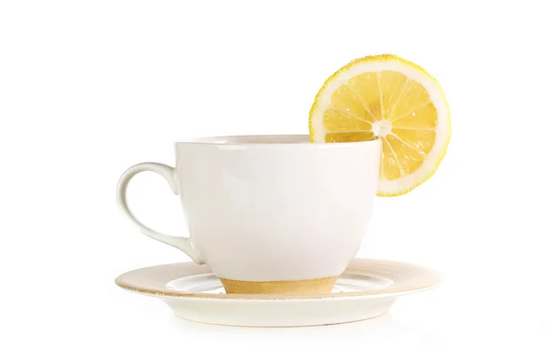 Taza llena de té con limón —  Fotos de Stock