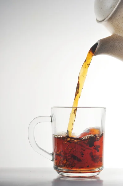 stock image Cup of tea and teapot