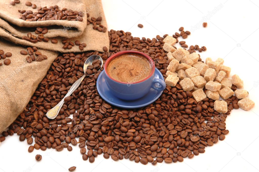 Coffee beans and cup with coffee