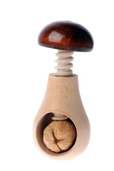 Walnut inserted into nutcracker — Stock Photo, Image