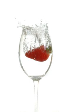 Strawberry drop into glass clipart