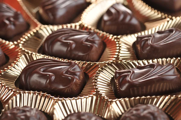Gold foil box of chocolates — Stock Photo, Image
