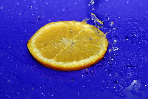 Water drops on sliced orange — Stock Photo, Image
