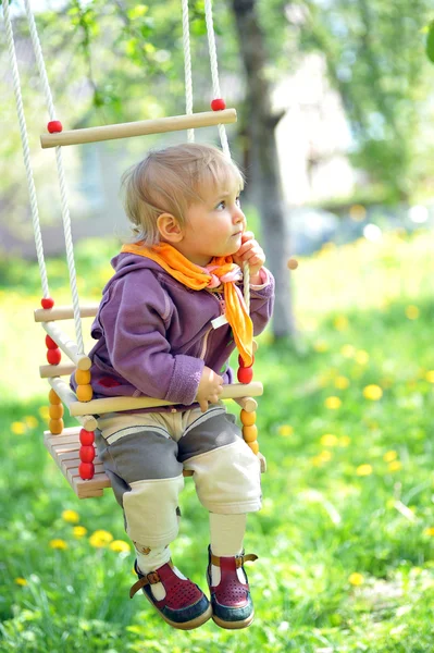 Swinging girl — Stock Photo, Image
