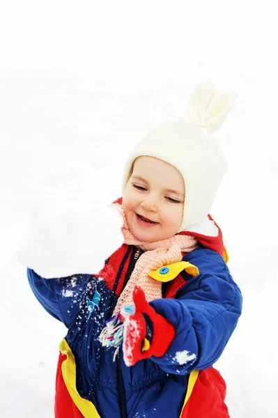 Girl plays with snow — Stock Photo, Image