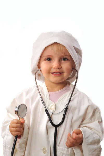 Mooi meisje spelen arts — Stockfoto