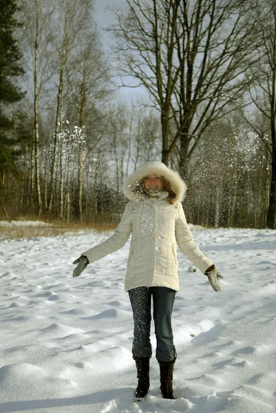 Girl frowing snow — Stock Photo, Image