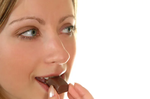 stock image Young woman eat chocolate