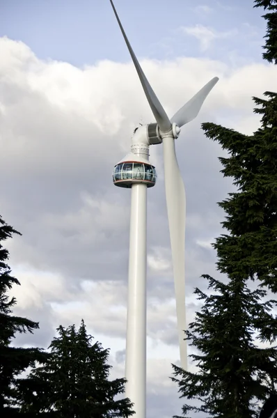 Wind Turbine above the trees — Stock Photo, Image