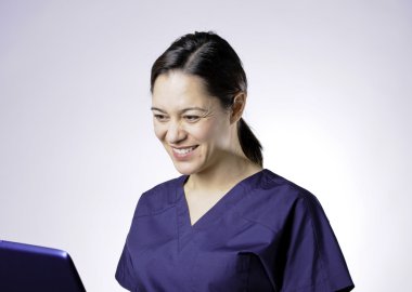 Smiling asian medical assistant. clipart