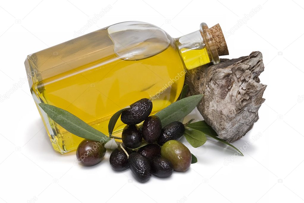 Olive oil bottle and olives.