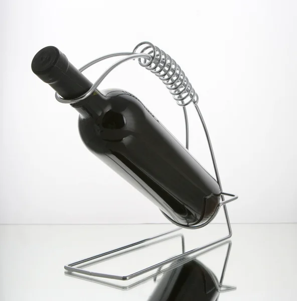 Bottle of wine in wine holder — Stock Photo, Image