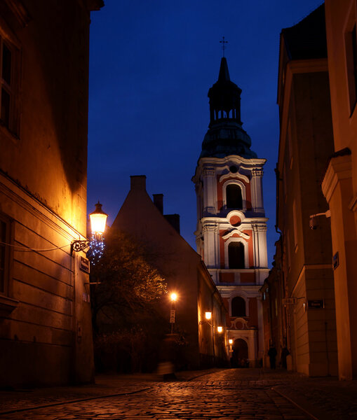 Old town at night in Poznań, Klasztorna street