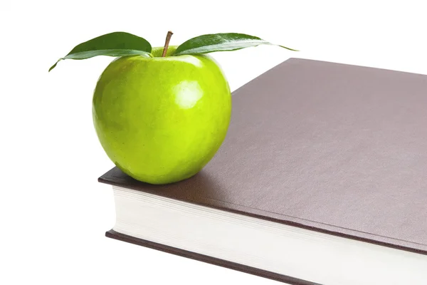 Kniha a zelené jablko — Stock fotografie