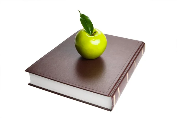Книга і зелене яблуко — стокове фото