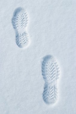 Hot footsteps on cold snow clipart