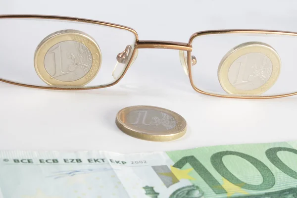 Abstract eye-glasses coins and banknote — Stock Photo, Image