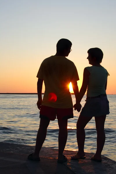 stock image Romantic pair looking at each other at sunset