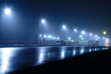 Lights and light traces on road clipart