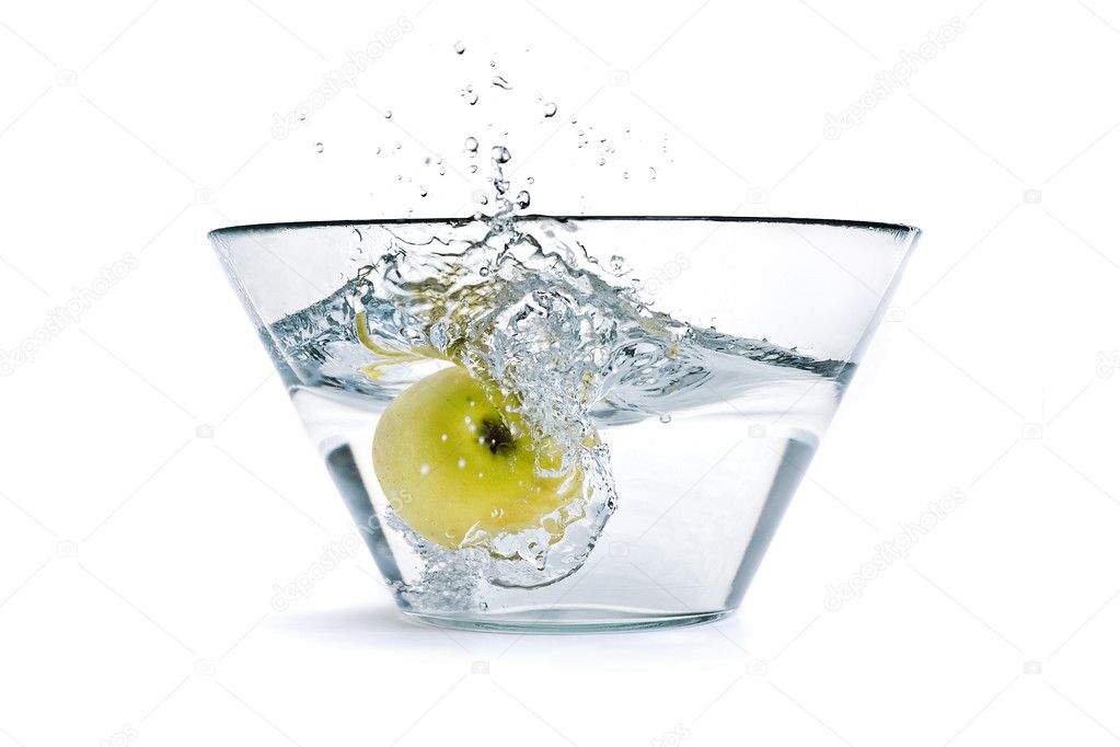 Apple falling into a container of water — Stock Photo ...